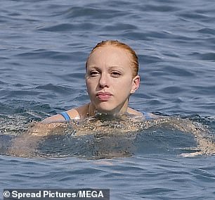 The star showed off her uncanny resemblance to her father as she swam