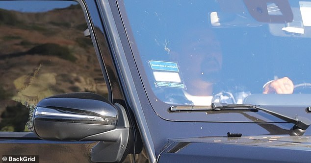 Paul sat in the driver's seat of Britney's Mercedes G500 SUV after their meal, with Britney in the passenger seat