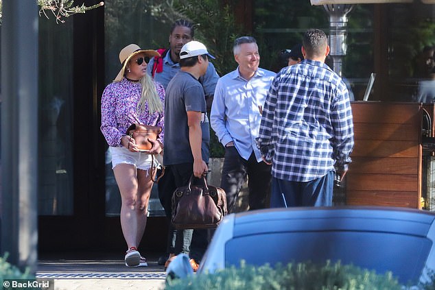 Britney has been seen with Paul and several others, but it's not clear if they were one large group