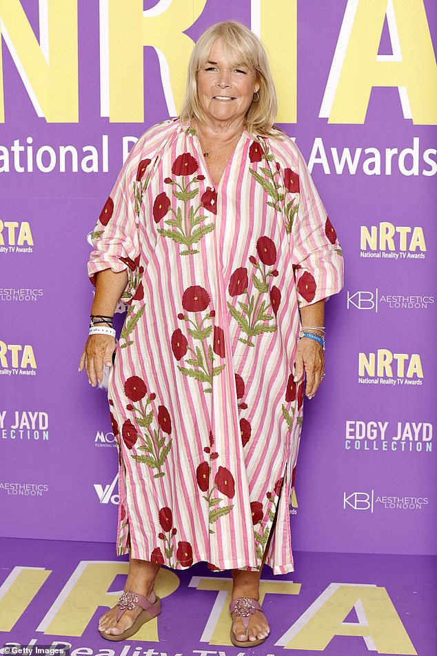 Linda Robson embraced a summery look in a pink and white dress with red flowers