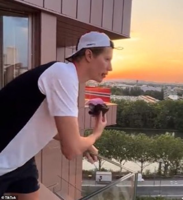 In another photo he stood on his porch watching the sunset, a muffin in tow