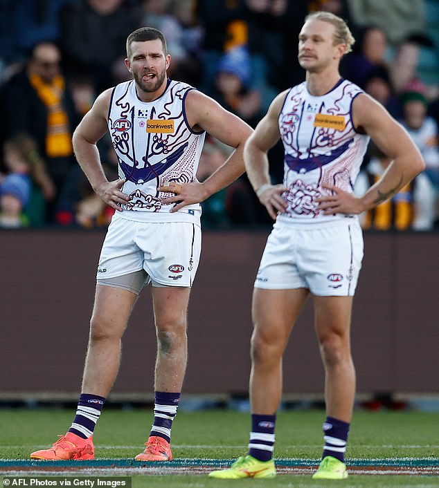 The sickening scenes unfolded on a flight from Launceston to Perth - Dockers stars Luke Ryan (pictured left) and Corey Wagner after the loss to Hawthorn on July 13