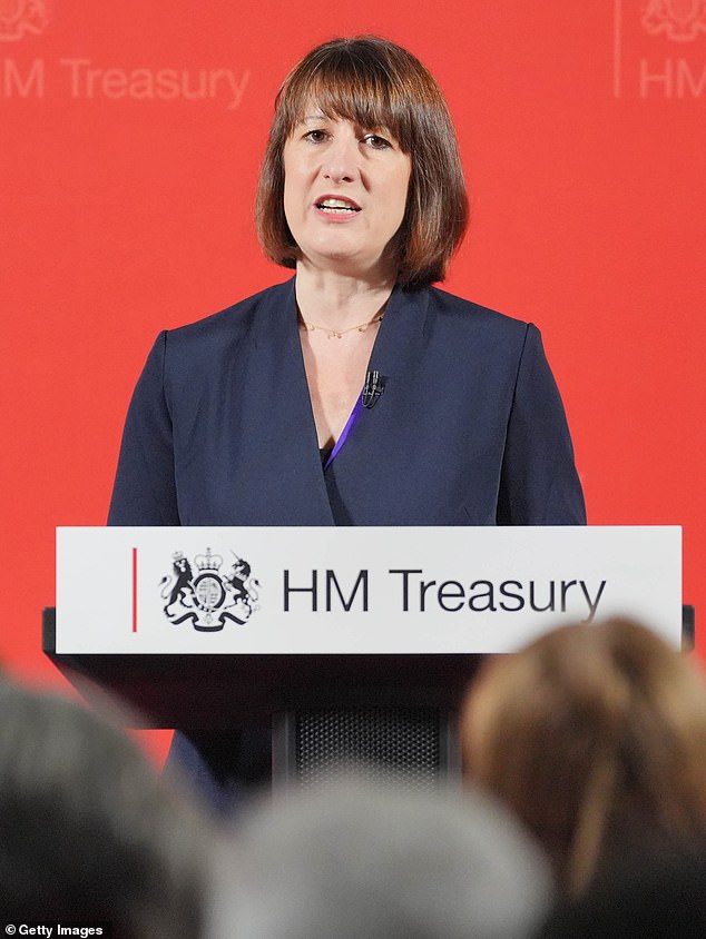 Rachel Reeves, dressed in a sober black suit, against a red screen showing Labour, unveiled her plans to 