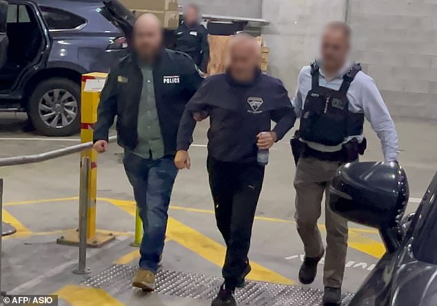 The couple are the first Australians to be charged with espionage after coming to Australia more than a decade ago and gaining Australian citizenship (pictured is Igor being arrested)