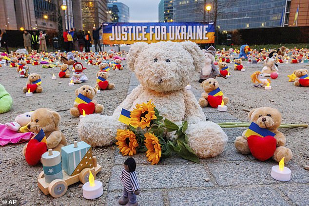 Avaaz members and Ukrainian refugees place teddy bears in front of the European Commission in Brussels to draw attention to the reported abduction of thousands of Ukrainian children by Russia on February 23, 2022
