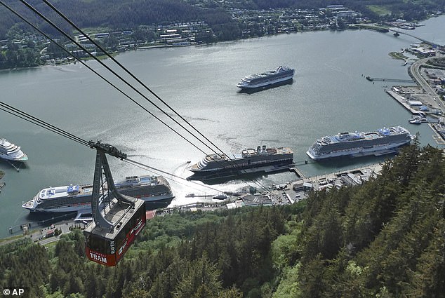 Cruise ships are shown near downtown Juneau on June 7, 2023, along the Gastineau Channel, in Alaska. Voters in Alaska's capital city could decide in October whether to ban large cruise ships on Saturdays starting next year