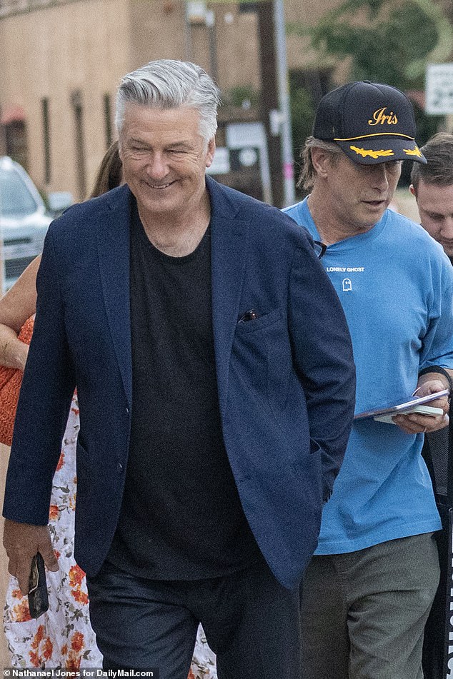 Alec Baldwin had a big grin on his face as he walked into a New Mexico restaurant to celebrate the dismissal of his manslaughter trial