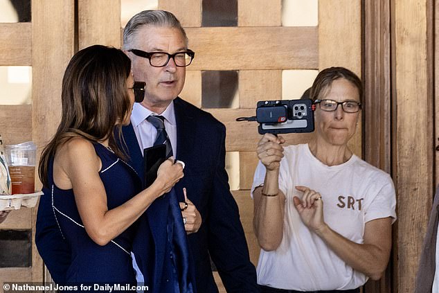 Jenna Rosher, wearing a white T-shirt and jeans with the initials SRT, apparently had her own special access to film the Baldwins