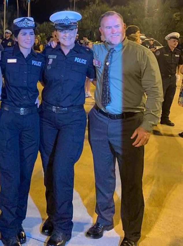 Chris (right in photo) and Jenny Hopper (center in photo) at their daughter Charlee's police graduation ceremony