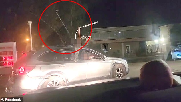 In footage posted to the Action for Alice Facebook page, a motorist films a tyre iron being thrown at his vehicle from a hatchback blocking a street in Alice Springs