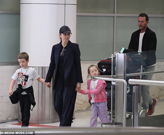 Allison, 45, appeared unfazed by the allegations as she walked through Sydney airport with her husband Michael Willesee Jr. and their two children — son Mack, 7, and daughter Scout, 4 — on Friday.