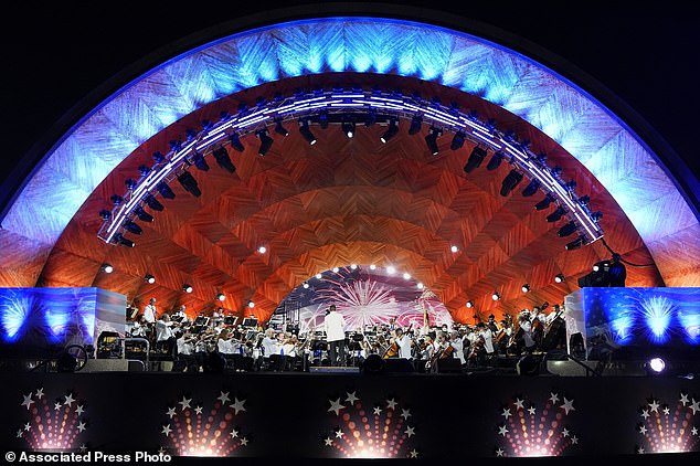 The Boston Pops Esplanade Orchestra performs during the Boston Pops Fireworks Spectacular at the Hatch Memorial Shell on the Esplanade in Boston