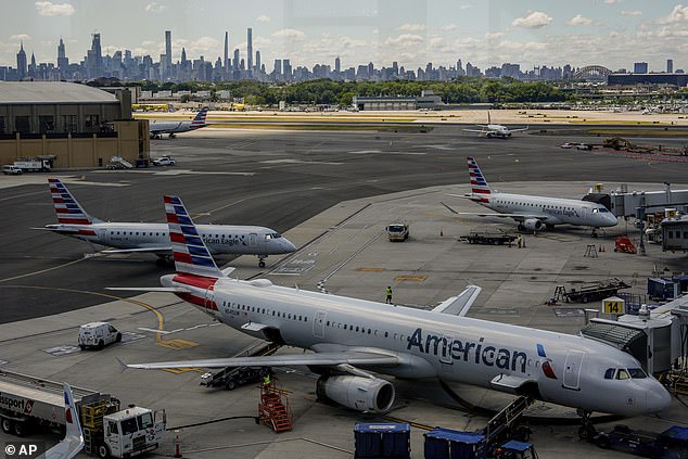 American Airlines planes sit at a terminal at LaGuardia Airport