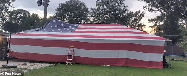 A father and son from Louisiana decorated their home with a 50-foot, 60-pound American flag