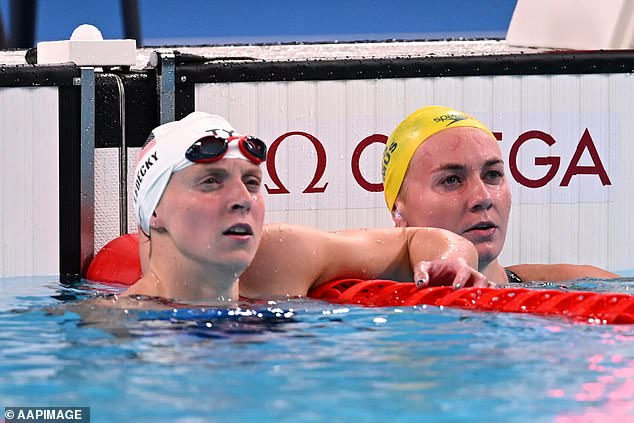 Katie Ledecky of the United States (left) and Ariarne Titmus of Australia (right) react after a 400m freestyle heat at the Paris 2024 Olympic Games