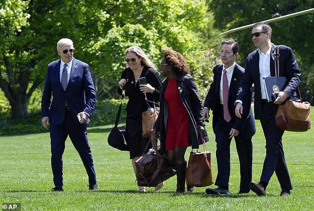 President Joe Biden, from left, walks with Deputy White House Chief of Staff Annie Tomasini, White House Press Secretary Karine Jean-Pierre, Deputy White House Chief of Staff Bruce Reed and White House Communications Director Ben LaBolt. Reports have indicated that the president's top advisers are isolating him from mid-level staffers, raising concerns about his condition