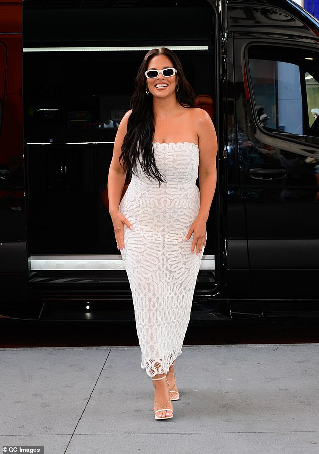 Ashley Graham looked stylish in a white lace dress at an in-store event for Ulta Beauty as a St. Tropez ambassador on Wednesday