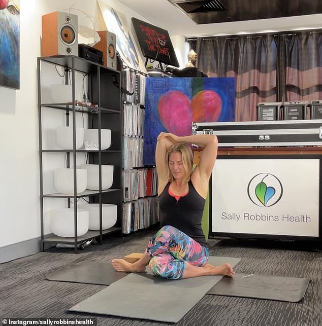 The former female eight-rower is now a holistic health coach and yoga teacher in Perth (pictured in her studio)