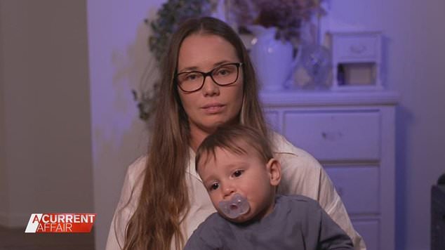 Young mother Emma Robertson (pictured with her baby son) believes the tax cuts are not enough to keep families afloat during the cost of living crisis