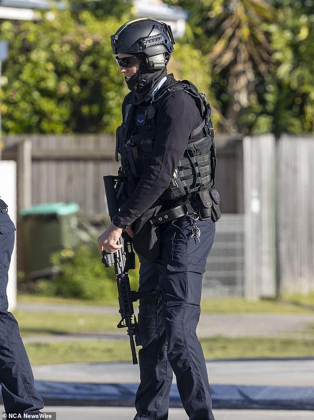 A police tactical team was on site and the woman was freed unharmed after a tense confrontation