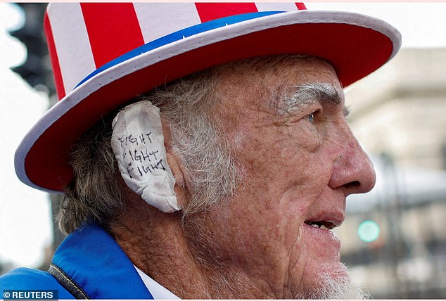 In a sign of the near-feverish support for Trump, Republican delegates were seen wearing their own bandages over their ears