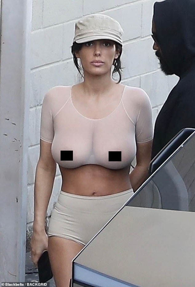 Kanye West's wife Bianca Censori shocked when she flashed her bare breasts in a sheer top at the cinema on Tuesday - after the beauty shocked in a micro bikini at the Chateau Marmont