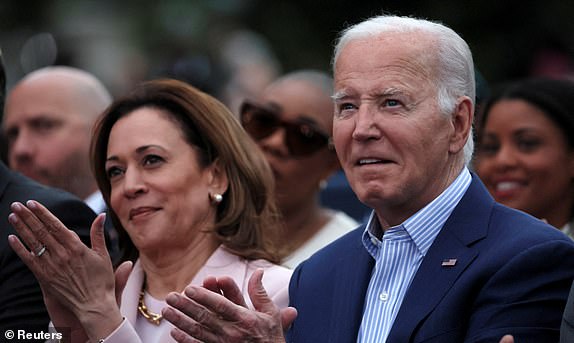 ARCHIVE PHOTO: U.S. President Joe Biden claps next to U.S. Vice President Kamala Harris during a Juneteenth concert on the South Lawn at the White House in Washington, D.C., U.S. June 10, 2024. REUTERS/Leah Millis/File photo
