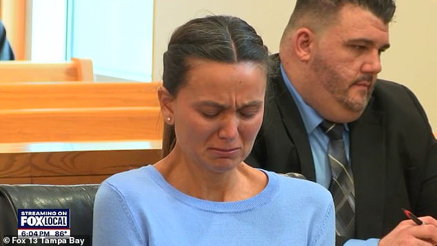 Ashley Benefield, 32, was seen crying in court Tuesday as she listened to the 911 call a neighbor made in the minutes after she killed her estranged husband