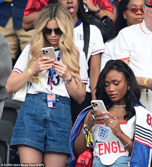 Tolami Benson - Bukayo Saka's girlfriend - appeared to be scrolling through her phone as the match neared halftime