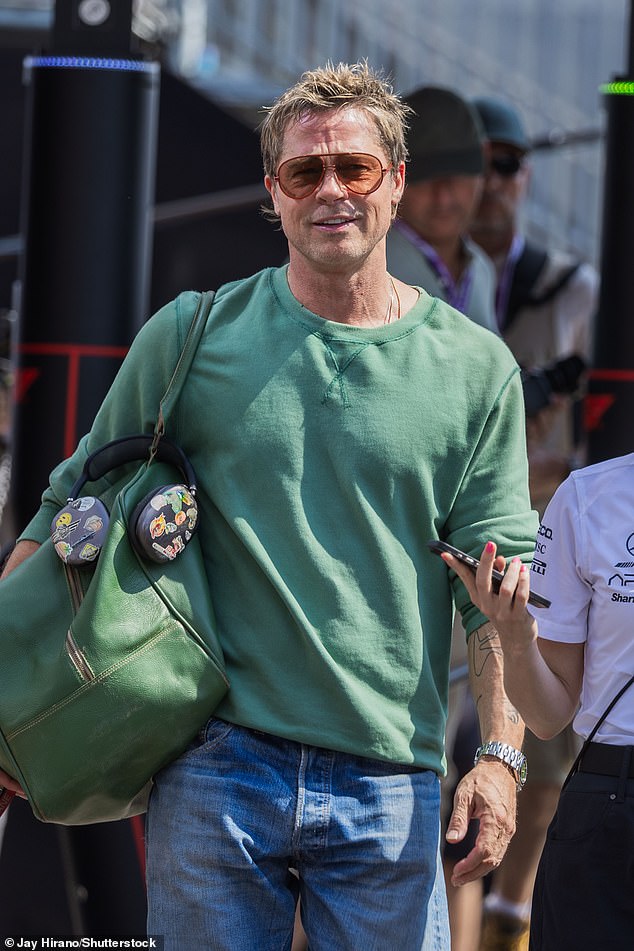 Brad Pitt showed off his youthful looks as he made a radiant entrance at the Hungarian Grand Prix in Budapest on Friday morning, ahead of filming new scenes for his upcoming Formula 1 film