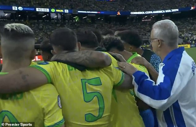 Dorival (right) was earlier seen on the outside of a team meeting ahead of the penalty shootout