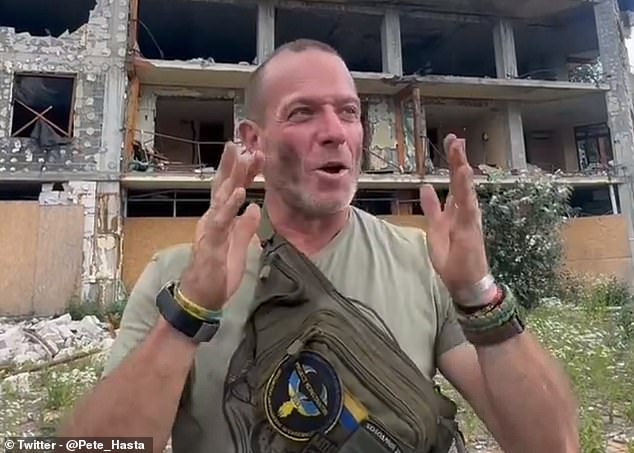 In this screenshot, taken from a clip on social media, Fouché stands in front of a damaged building in Ukraine