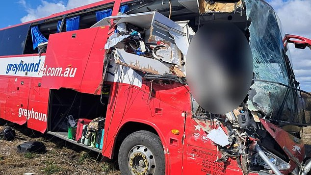 Pictured: The crumpled remains of a caravan were left in front of the Greyhound bus after the crash