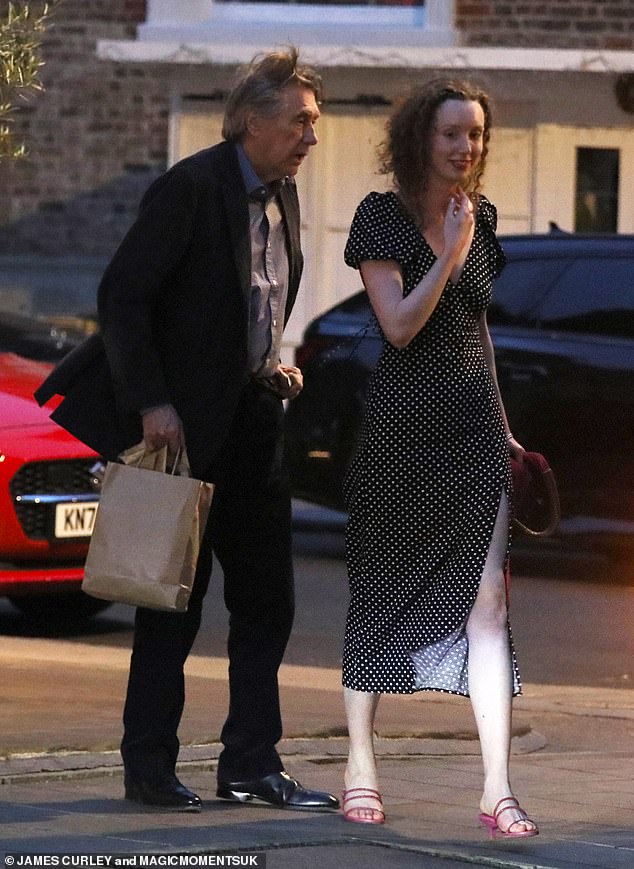Bryan Ferry, 78, is pictured leaving dinner at Harry's Bar in Mayfair with gallery owner Tatty Cullen, 24, in London's Mayfair on Monday evening.