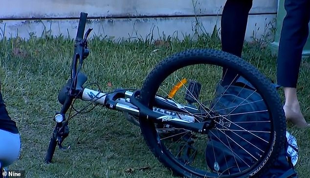 The boy was cycling home from school at the time. The photo shows his abandoned bike and school bag at the crime scene