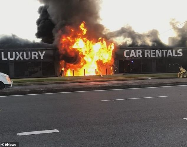 A man has been charged with arson over a massive fire that broke out at a car rental company on the Gold Coast