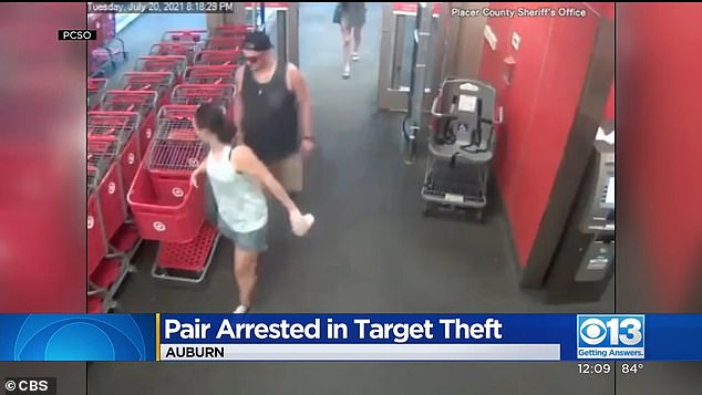 A couple is seen walking into the Target in Auburn before surveillance footage captures them stealing something from the store