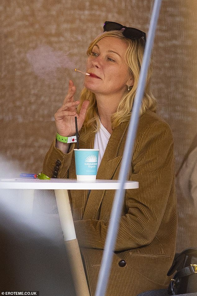 The stars were photographed amongst a host of big names in attendance, with Kirsten Dunst (pictured) also spotted enjoying a smoke break