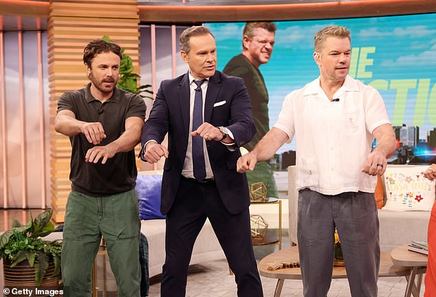 Actors Casey Affleck, 48, and Matt Damon, 53, showed off their dance moves during an appearance on the Univision talk show Despierta América on Monday to promote their upcoming film The Instigators. Pictured with host Alan Tacher