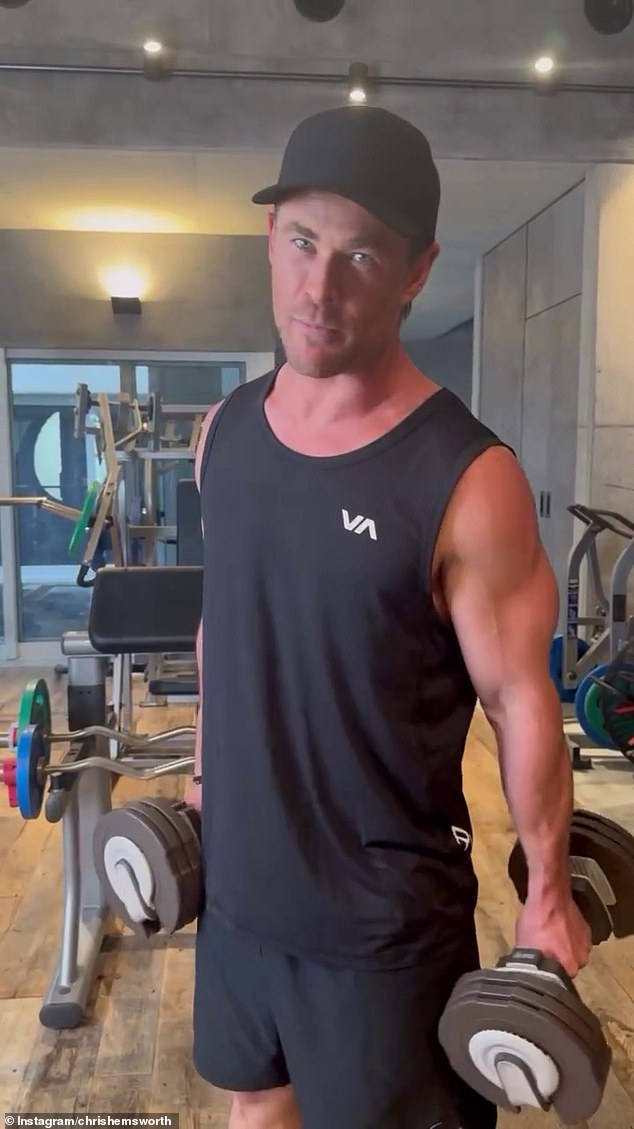 Chris, 40, barely broke a sweat in the clip, showing off his en pointe guns in a black RCVA tank top, black athletic shorts and a plain black baseball cap as he completed his killer workout