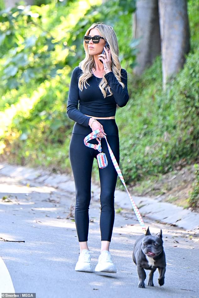 The thrice-married reality star, 41, whose split from Joshua, 44, was revealed on Tuesday, couldn't muster a smile as she walked her dog and showed off her ringless finger