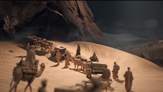 A line of traders marches through the desert