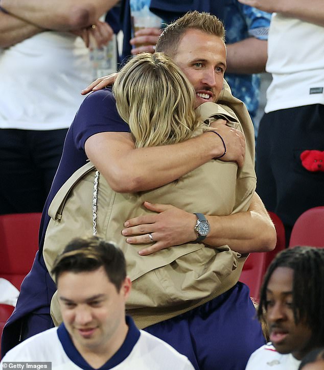 Captain Harry Kane wrapped his arms around his wife Katie