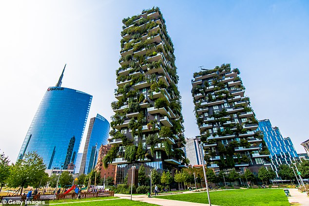 View of the 'Bosco Verticale' and 'Unicredit Tower' - skyscrapers in Porta Nuova, the business district of Milan, Italy. Plant-covered buildings help capture carbon