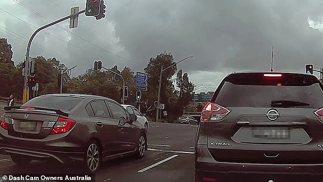 The cyclist and his bike flew through the air in the collision at the busy intersection