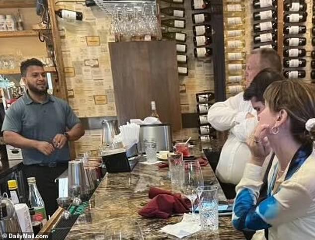 Democratic Senator Jon Tester of Montana (top right) enjoys a vodka cranberry at a bar in Washington, D.C. on Tuesday.