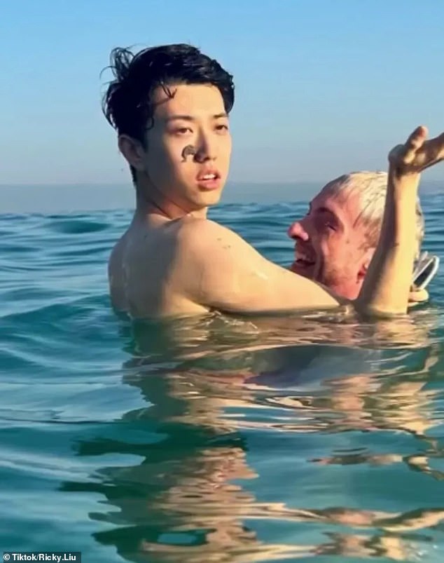 Ricky Liu (pictured left) and his friend Craig (pictured right) were taking pictures on the beach when children reportedly started throwing sand at the couple