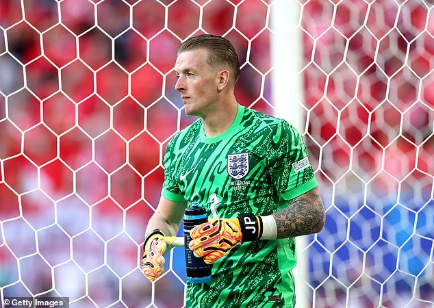 Jordan Pickford looks on as he holds his water bottle with a list of penalty takers during the Euro 2024 quarter-final