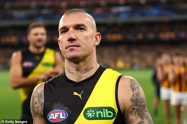 AFL great David Schwarz says Richmond champion Dustin Martin (pictured) will '100 per cent' play for the Gold Coast Suns next season