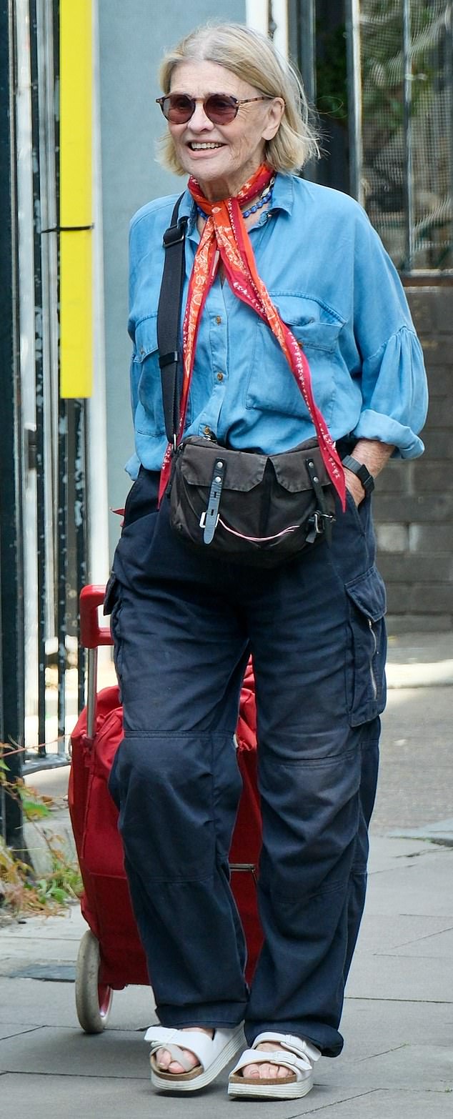 Screen siren Julie Christie, now 84, still looks stylish even as she runs errands near her east London home. She was seen pulling a shopping trolley while wearing cargo pants, a denim shirt and white sandals